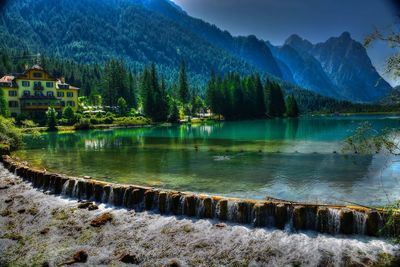 Scenic view of lake and mountains against sky