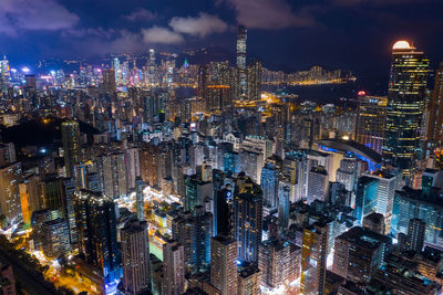 Aerial view of modern buildings in city at night