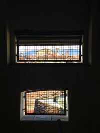 Illuminated building seen through window