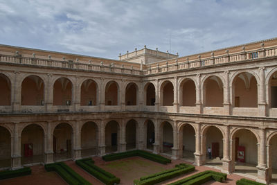 View of historic building against cloudy sky