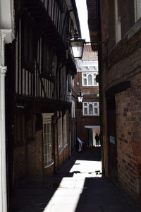 Empty alley amidst residential buildings