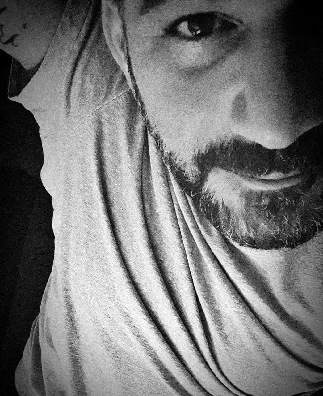 one person, portrait, black and white, white, adult, looking at camera, front view, monochrome photography, black, monochrome, close-up, human face, indoors, young adult, beard, lifestyles, facial hair, headshot, human eye, person, men, women, human head, darkness, leisure activity