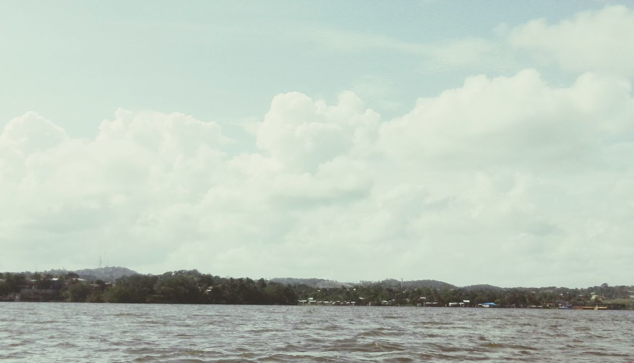 waterfront, water, sky, tranquil scene, tranquility, scenics, beauty in nature, cloud - sky, sea, lake, nature, river, rippled, cloudy, mountain, cloud, idyllic, day, outdoors, no people