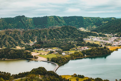 Scenic view of lake and trees against sky