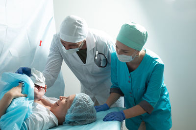 Rear view of man working at clinic