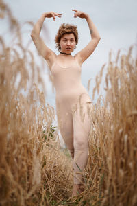 Full length of woman standing on field