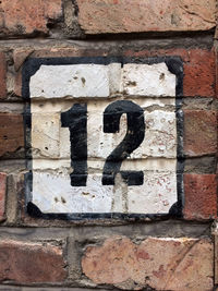 Close-up of number 12 brick wall