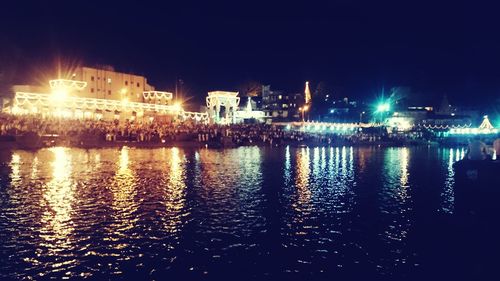 Reflection of illuminated buildings in water at night