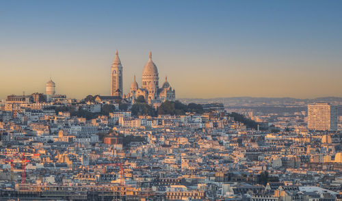 Aerial view of paris with montmartre in background at sunset