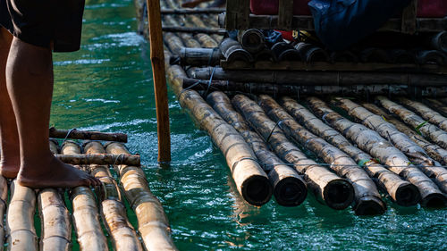 Punting down a river on bamboo rafts