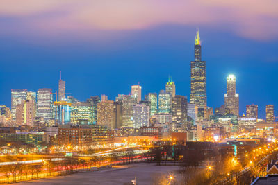 Illuminated buildings in city at night