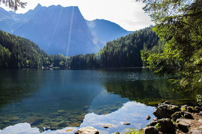 Scenic view of lake and mountains against sky