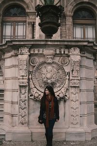 Woman standing in front of building