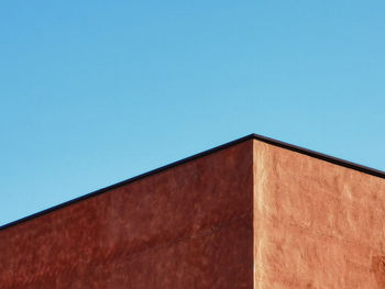 Low angle view of building against blue sky