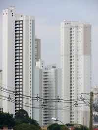 Modern buildings in city against sky