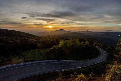 Scenic view of mountains against sky at sunset