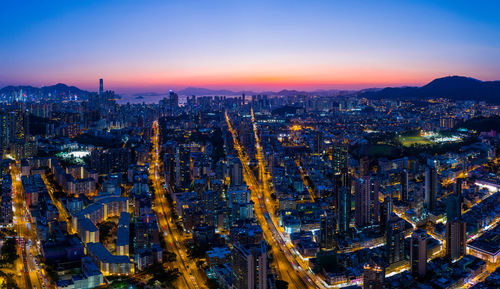 Aerial view of city against sky during sunset