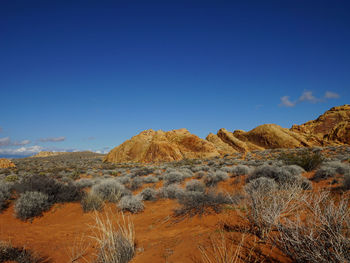 Scenic view of rocky mountains against clear blue sky