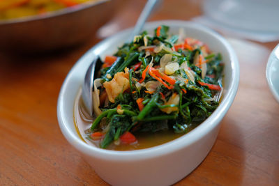 High angle view of salad in bowl on table