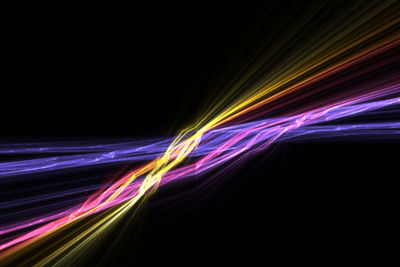 Light trails against black background