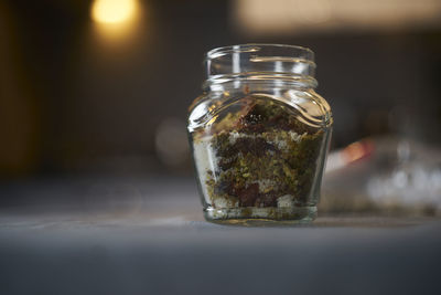 Close-up of glass of jar on table