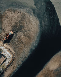 High angle view of man on rock at beach