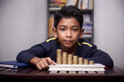 Portrait of boy on table