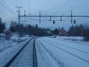 Snowcapped railroad tracks during winter