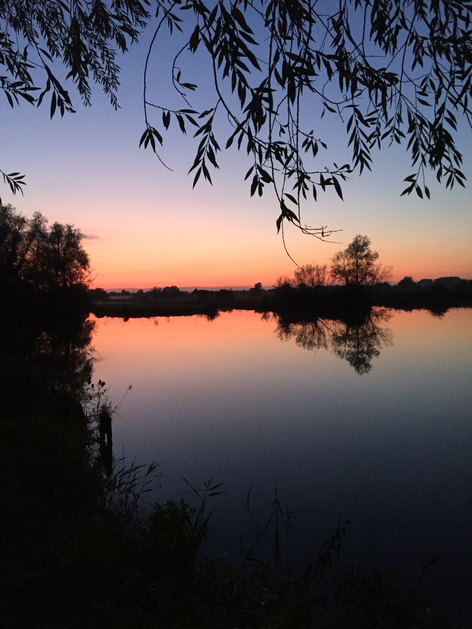 SCENIC VIEW OF LAKE AGAINST ROMANTIC SKY