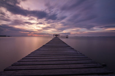 Jetty leading to calm sea