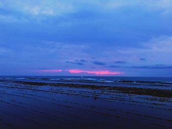 Scenic view of sea against sky at sunset