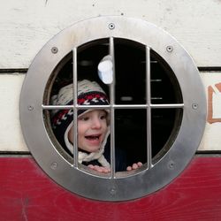 Boy seen through ship window