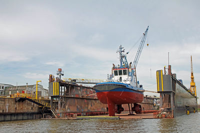 Boats moored at harbor