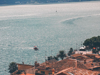 High angle view of buildings by sea