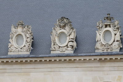 Low angle view of sculptures on building