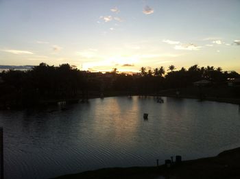 Scenic view of river at sunset