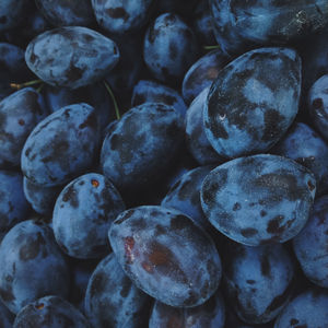 Full frame shot of black plums on market stall