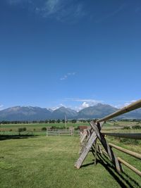 Fence on field against sky