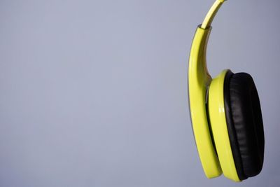 Directly above shot of yellow colored pencils against white background