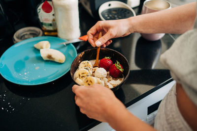 Midsection of person preparing food