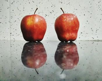 Close-up of apple on wet table