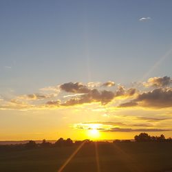 Scenic view of landscape against sky during sunset