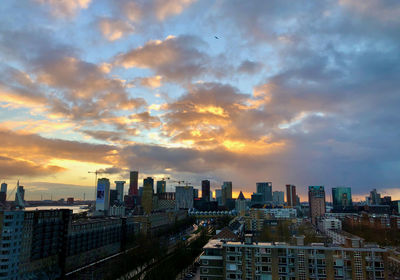 High angle view of buildings against sky during sunset