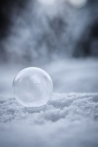 Close-up of bubbles against sky during winter