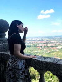 Side view of young woman looking at view