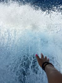 Low section of woman in swimming pool