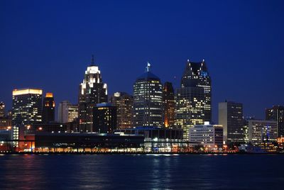 Illuminated city at waterfront