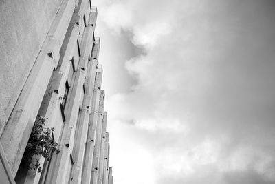 Low angle view of historic building against cloudy sky