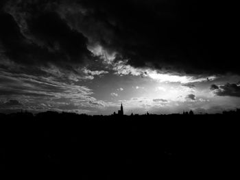 Scenic view of silhouette against sky at sunset