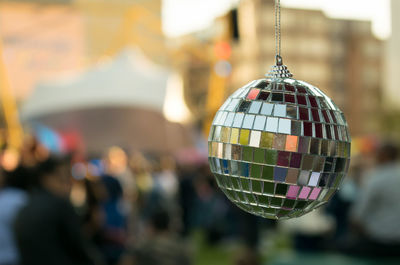 Close-up of decorations hanging against blurred background